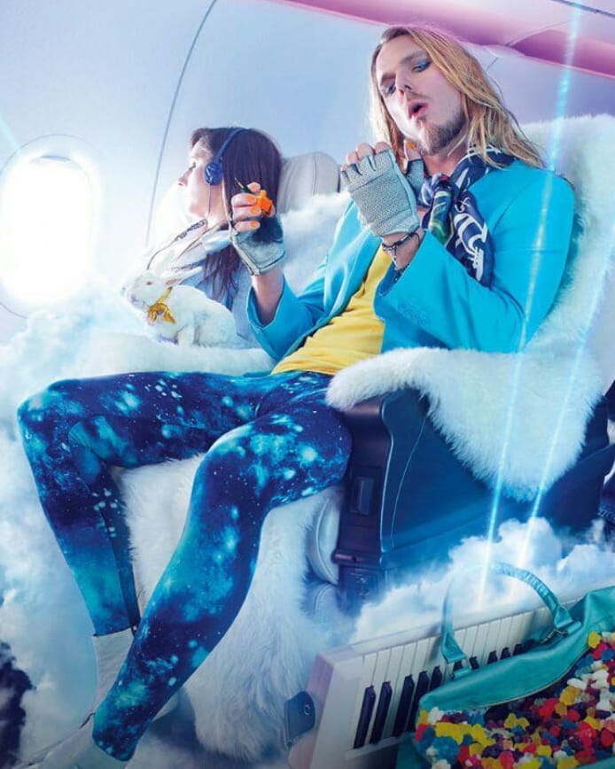 Hair rocker sitting in fur covered airplane seat