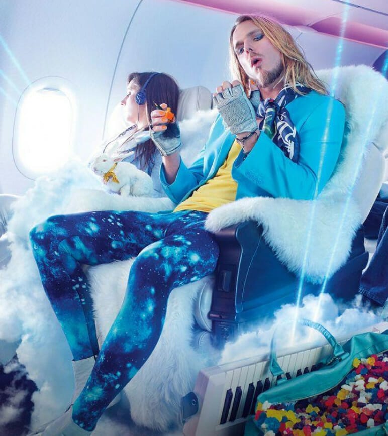 Hair rocker sitting in fur covered airplane seat